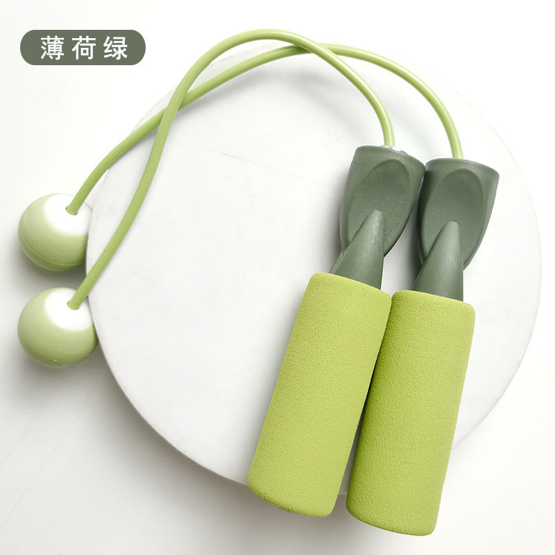 Double-bearing cordless rope skipping device